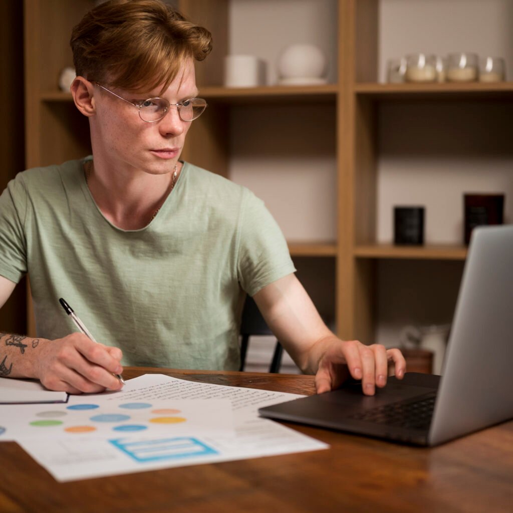Desk with laptop, SEO analytics and keyword notes